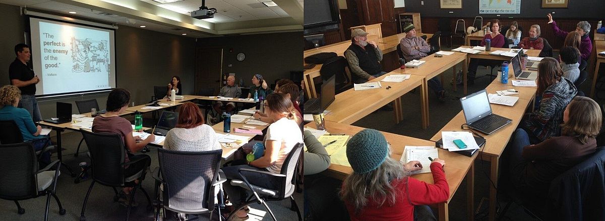 folks gather around a conference table in discussion