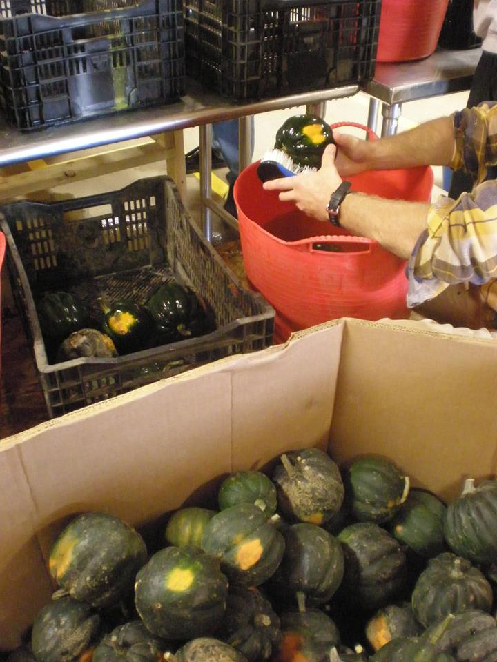 Scrubbing squash at Southeast State Correctional Facility