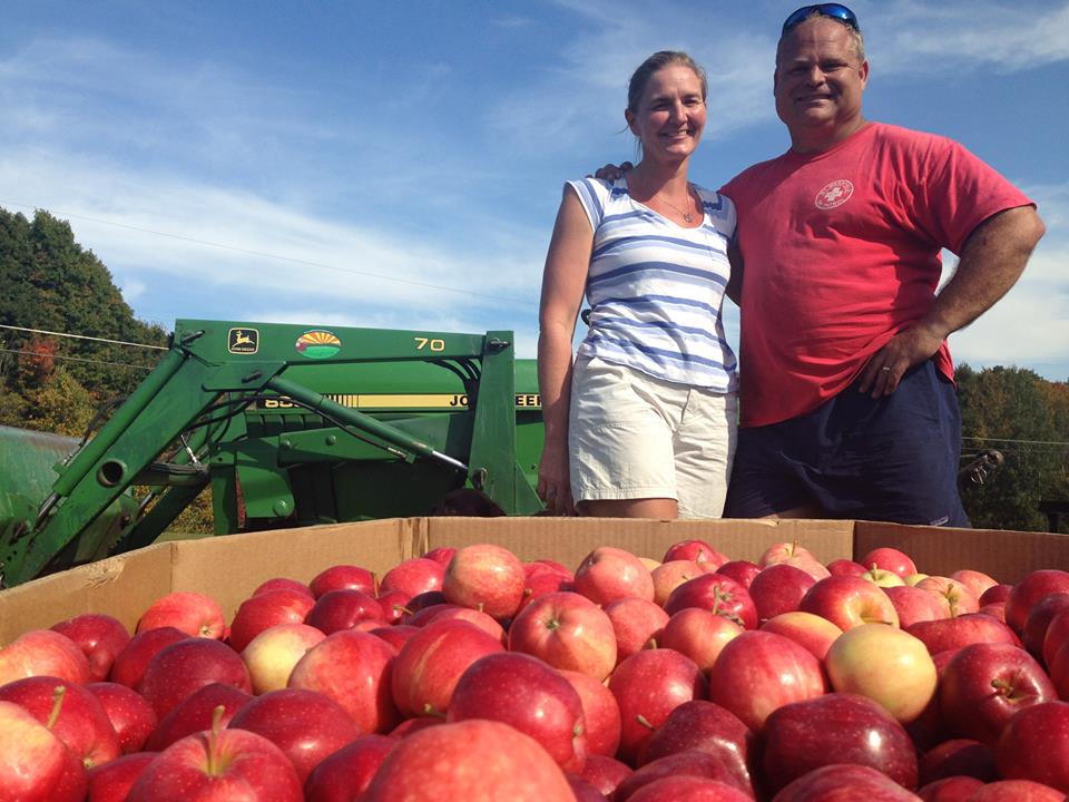 Steve and Jessika Yates with apple harvest